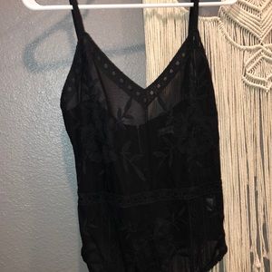 Black mesh lace detail body suit. Never worn.